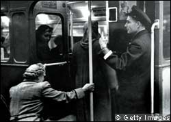 Passengers entering a London bus in the 1940s